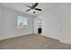 Spacious bedroom with ceiling fan and en-suite bathroom at 6692 Radiant Red Ave, Las Vegas, NV 89130