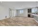 Open concept dining area with wood-look floors and access to kitchen at 6692 Radiant Red Ave, Las Vegas, NV 89130