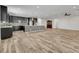 Spacious kitchen with dark cabinetry, mosaic backsplash, and an island at 6692 Radiant Red Ave, Las Vegas, NV 89130