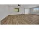 Bright and airy living room with wood-look floors and lots of natural light at 6692 Radiant Red Ave, Las Vegas, NV 89130