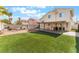 Backyard featuring artificial turf and a covered patio at 6712 Painted Canyon Ct, Las Vegas, NV 89130