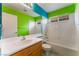 Bright bathroom with a shower and tub combination and single sink vanity at 6712 Painted Canyon Ct, Las Vegas, NV 89130