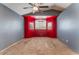 Spacious bedroom featuring a ceiling fan, large window, and neutral carpet at 6712 Painted Canyon Ct, Las Vegas, NV 89130