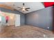 Bedroom with a ceiling fan and neutral carpet, ready for personalization and decor at 6712 Painted Canyon Ct, Las Vegas, NV 89130