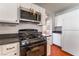 Close up of the kitchen appliances including a gas range, microwave and refrigerator at 6712 Painted Canyon Ct, Las Vegas, NV 89130