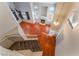 View from top of stairs to living room with fireplace and large windows at 6712 Painted Canyon Ct, Las Vegas, NV 89130