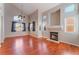 Spacious living room with high ceilings, fireplace, lots of natural light, and wood floors at 6712 Painted Canyon Ct, Las Vegas, NV 89130