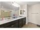 Bathroom with double vanity, large mirror, and a separate shower at 685 Sea Star St, Henderson, NV 89002