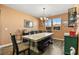 Charming dining room features a rustic table, chandelier, and hardwood floors at 685 Sea Star St, Henderson, NV 89002