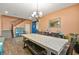 Bright dining room with a farmhouse table and access to the staircase at 685 Sea Star St, Henderson, NV 89002