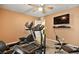 Home gym with a treadmill, elliptical, and weight bench at 685 Sea Star St, Henderson, NV 89002