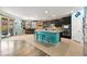 Modern kitchen with granite countertops and teal island at 685 Sea Star St, Henderson, NV 89002