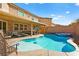 Inviting backyard oasis featuring a sparkling pool and spa at 685 Sea Star St, Henderson, NV 89002