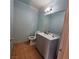 Bathroom with single vanity, toilet, and tiled floors at 7090 Burcot Ave # B32, Las Vegas, NV 89156