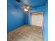 Bright bedroom with ceiling fan, carpet, and spacious closet at 7090 Burcot Ave # B32, Las Vegas, NV 89156