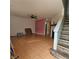 Living room with tile floors, fireplace, and staircase at 7090 Burcot Ave # B32, Las Vegas, NV 89156