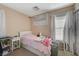 Small bedroom with twin bed and Hello Kitty decor at 7182 Hood River Ave, Las Vegas, NV 89179