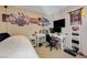 Bedroom with twin bed, desk and anime wall art at 7182 Hood River Ave, Las Vegas, NV 89179