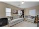 Living room with two sofas, bookcase and a guitar at 7182 Hood River Ave, Las Vegas, NV 89179