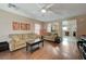 Living room with hardwood floors, sofa, and view of kitchen at 7182 Hood River Ave, Las Vegas, NV 89179