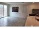 Bright dining area with tile floor, sliding glass door to backyard, and modern art at 7672 Lush Oasis Ave, Las Vegas, NV 89113