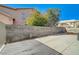 Spacious backyard with concrete and block wall at 7900 Holly Knoll Ave, Las Vegas, NV 89129