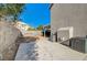 Backyard with concrete patio, block wall, and air conditioning units at 7900 Holly Knoll Ave, Las Vegas, NV 89129