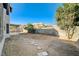 Large backyard with block wall, grassy area, and stepping stones at 7900 Holly Knoll Ave, Las Vegas, NV 89129