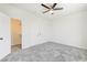 Bright bedroom with gray carpet and convenient access to a walk-in closet at 7900 Holly Knoll Ave, Las Vegas, NV 89129