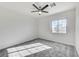 Bright bedroom featuring a ceiling fan and neutral carpeting at 7900 Holly Knoll Ave, Las Vegas, NV 89129