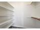 Spacious closet with built-in shelves and hanging rods at 7900 Holly Knoll Ave, Las Vegas, NV 89129