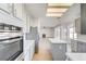 Modern kitchen featuring stainless appliances, a center island, and bright lighting at 7900 Holly Knoll Ave, Las Vegas, NV 89129