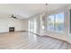 Living room with fireplace, lots of light and wood floors at 7900 Holly Knoll Ave, Las Vegas, NV 89129