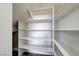 Bright white pantry with ample shelving for storage at 7900 Holly Knoll Ave, Las Vegas, NV 89129