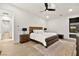 Spacious bedroom with a ceiling fan, nightstands, and a large window at 803 Bolide St, Las Vegas, NV 89138