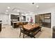 Open dining area with a farmhouse table and bench seating at 803 Bolide St, Las Vegas, NV 89138