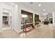 Bright entryway with tile flooring, a console table, and views into the living area and kitchen at 803 Bolide St, Las Vegas, NV 89138