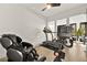 Home gym includes a treadmill, stationary bike, and massage chair at 803 Bolide St, Las Vegas, NV 89138