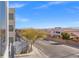 Balcony view of residential street and distant mountains at 8925 W Flamingo Rd # 213, Las Vegas, NV 89147