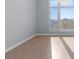 Bright bedroom with large window and wood floors at 8925 W Flamingo Rd # 213, Las Vegas, NV 89147