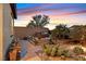 Spacious backyard with seating area and desert landscaping at 900 Mckinley View Ave, Henderson, NV 89012