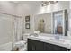 Clean bathroom with a vanity, toilet, shower, and bathtub at 900 Mckinley View Ave, Henderson, NV 89012