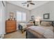 Guest bedroom with twin beds, dresser, and plantation shutters at 900 Mckinley View Ave, Henderson, NV 89012