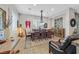 Elegant dining room with large wooden table and chandelier at 900 Mckinley View Ave, Henderson, NV 89012