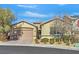 Single-story home with attached garage and landscaped front yard at 900 Mckinley View Ave, Henderson, NV 89012