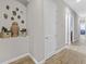 Bright hallway with decorative wall niche and wood-look flooring at 900 Mckinley View Ave, Henderson, NV 89012