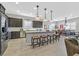 Modern kitchen with island, stainless steel appliances, and granite countertops at 900 Mckinley View Ave, Henderson, NV 89012