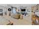 Open living area with hardwood floors and a large TV at 900 Mckinley View Ave, Henderson, NV 89012