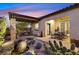 Covered patio with dining table and desert landscaping at 900 Mckinley View Ave, Henderson, NV 89012