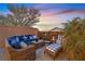 Relaxing patio featuring wicker furniture and blue accents at 900 Mckinley View Ave, Henderson, NV 89012